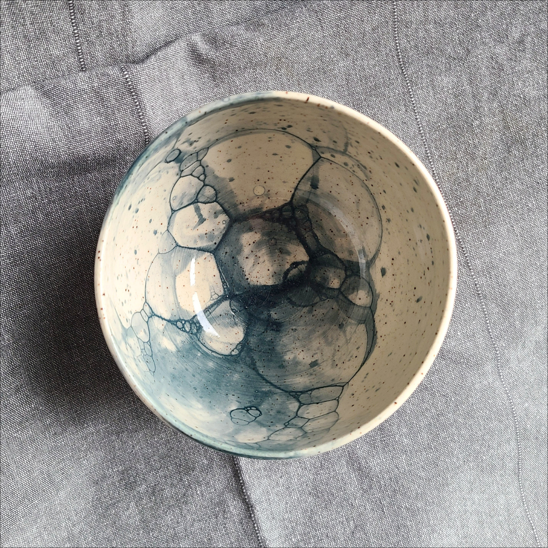 Blue breakfast bowl on speckled clay