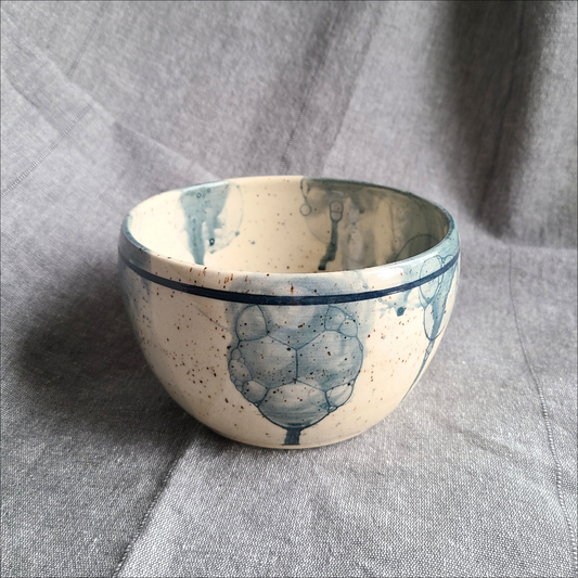 Blue breakfast bowl on speckled clay