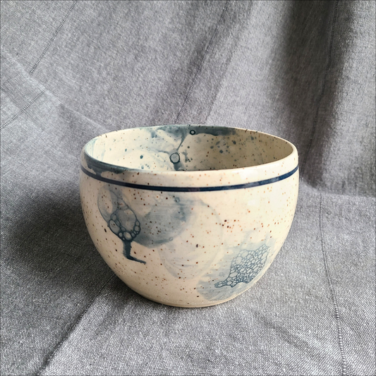 Blue breakfast bowl on speckled clay